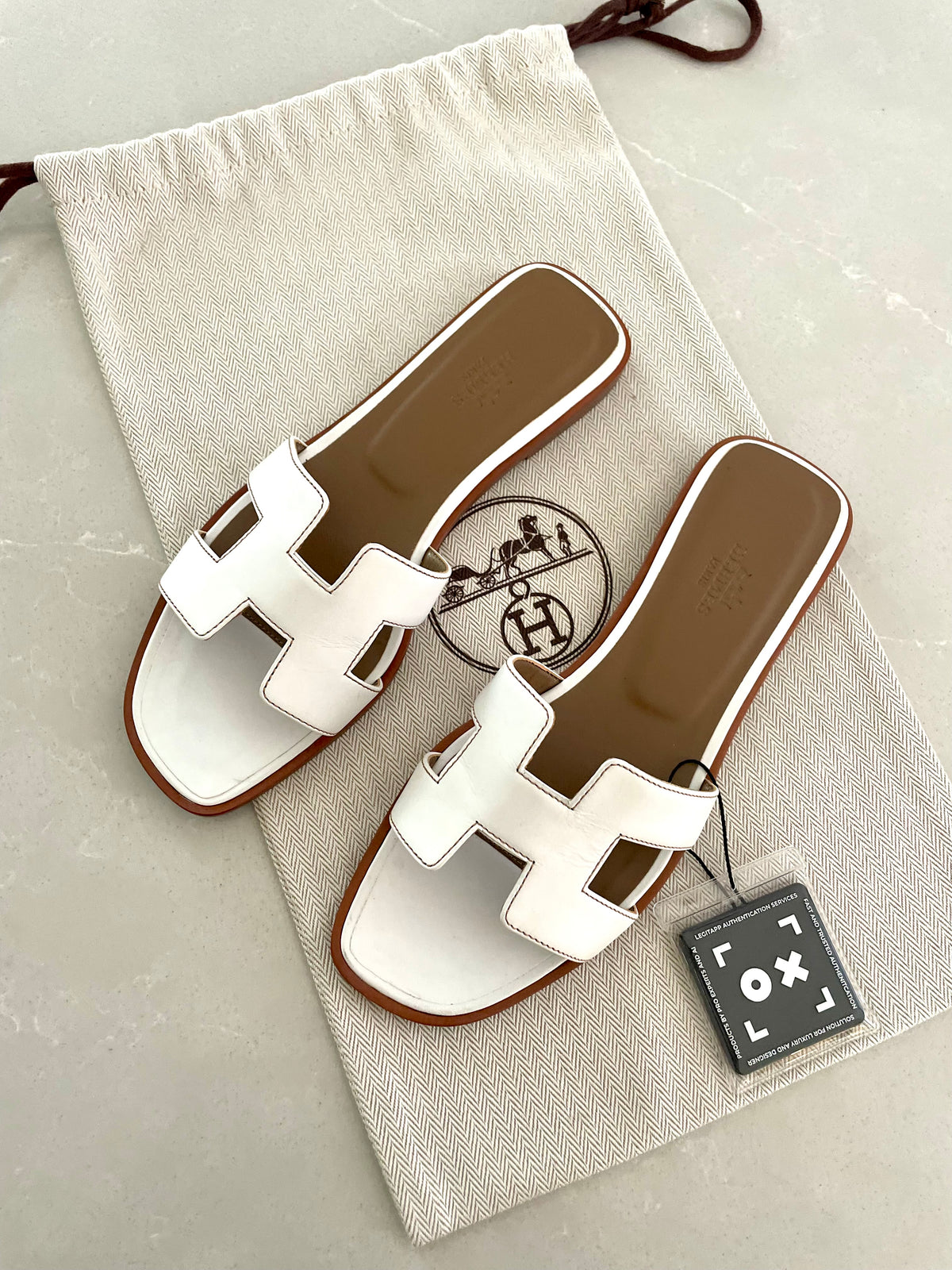 Hermès Oran sandals in white leather