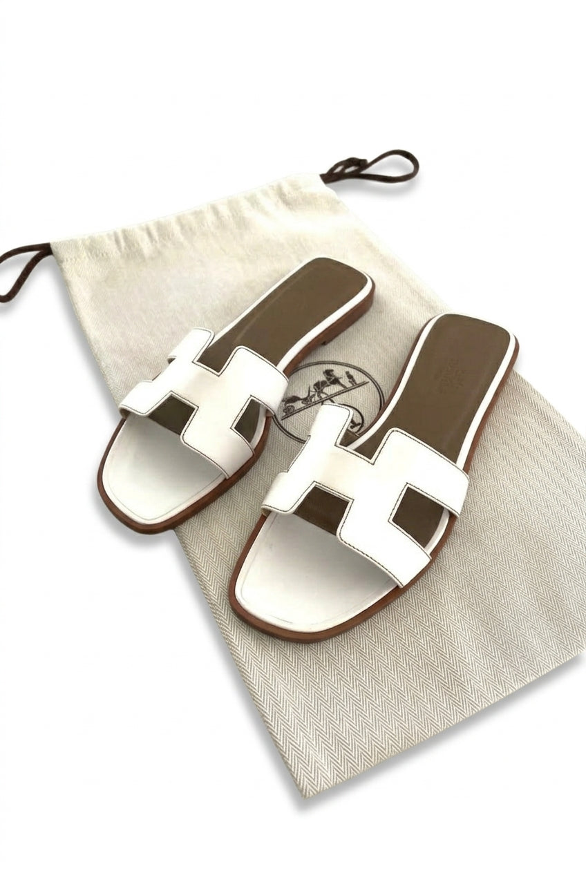 Hermès Oran sandals in white leather